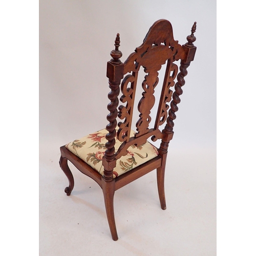 1434 - A Victorian small chair with ornately carved back