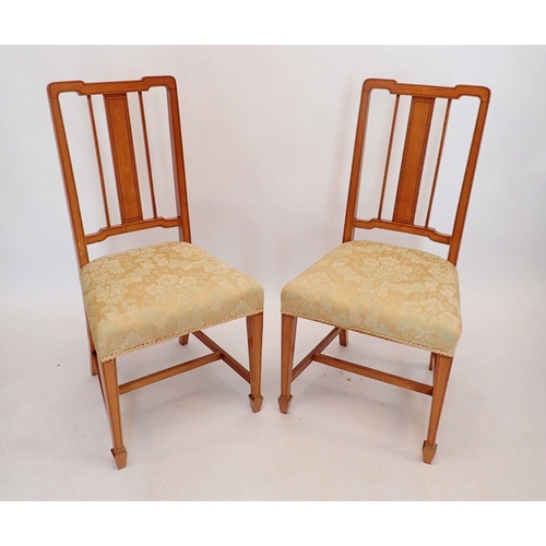 1436 - A pair of Edwardian satinwood slat back chairs on square tapered supports with spade feet