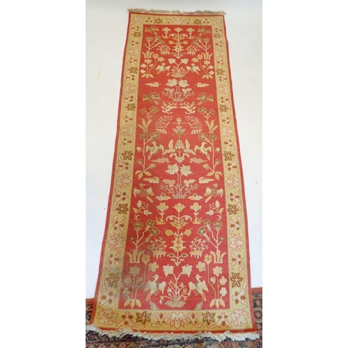 1441 - A Turkish style runner with floral design on coral ground, 271 x 93cm