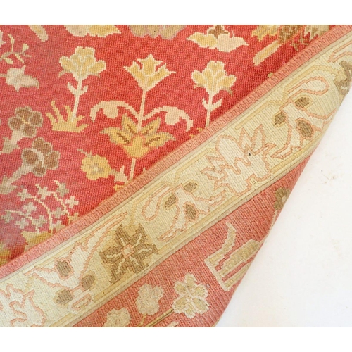 1441 - A Turkish style runner with floral design on coral ground, 271 x 93cm