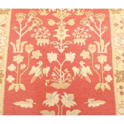 1441 - A Turkish style runner with floral design on coral ground, 271 x 93cm