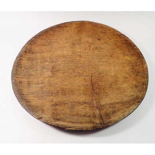 1442 - A large treen serving platter from Borneo, 53cm diameter