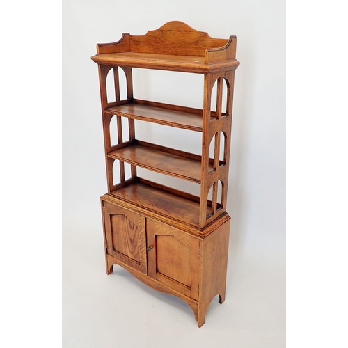 1445 - An early 20th century open oak bookcase with three shelves over cupboard, 60x128cm