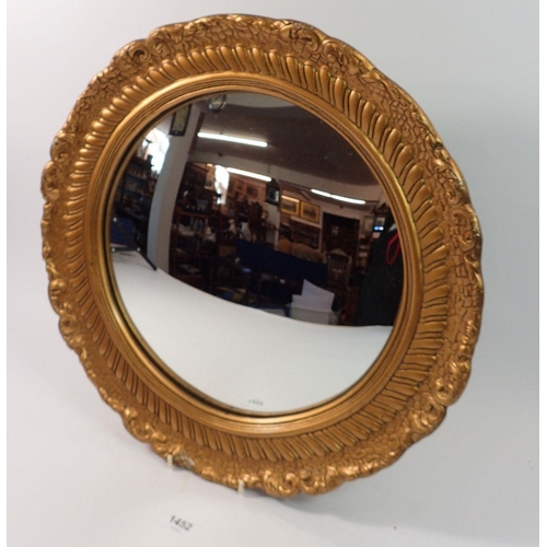 1452 - A gilt framed convex mirror, 41cm diameter