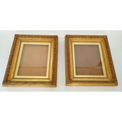 1464 - A pair of Victorian gilt wood and gesso glazed picture frames with classical leaf decoration, later ... 