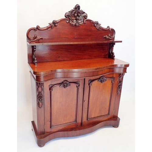 1471 - A Victorian mahogany chiffonier with shelf back over serpentine front, the two panelled cupboards wi... 