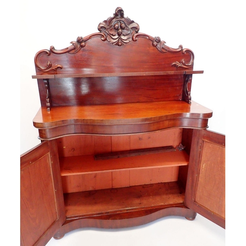 1471 - A Victorian mahogany chiffonier with shelf back over serpentine front, the two panelled cupboards wi... 