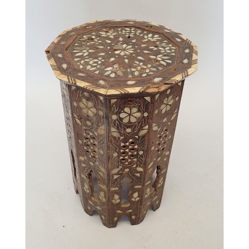 1489 - A Moroccan hardwood occasional table inlaid mother of pearl, 50cm tall, 32cm diameter