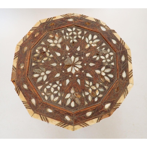 1489 - A Moroccan hardwood occasional table inlaid mother of pearl, 50cm tall, 32cm diameter