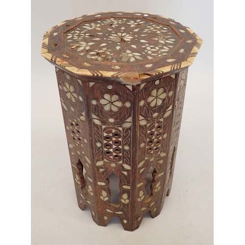 1489 - A Moroccan hardwood occasional table inlaid mother of pearl, 50cm tall, 32cm diameter