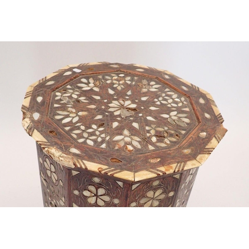 1489 - A Moroccan hardwood occasional table inlaid mother of pearl, 50cm tall, 32cm diameter