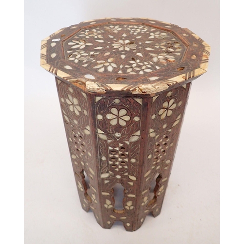 1489 - A Moroccan hardwood occasional table inlaid mother of pearl, 50cm tall, 32cm diameter