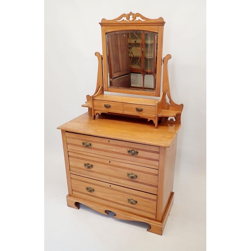 1496 - An Edwardian satinwalnut dressing table with swing mirror and trinket drawers over two short and two... 