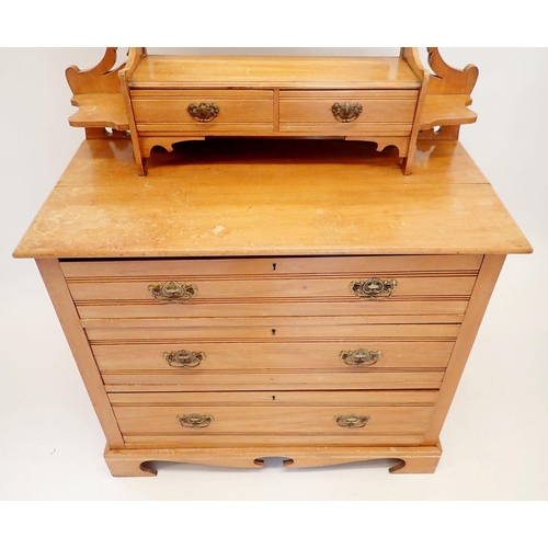 1496 - An Edwardian satinwalnut dressing table with swing mirror and trinket drawers over two short and two... 