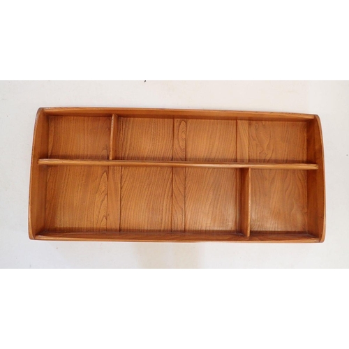 1499 - An Ercol lightwood display shelf, 107cm wide