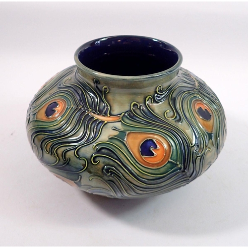 184 - A Moorcroft squat Phoenix pattern vase decorated peacock feathers, 12cm tall