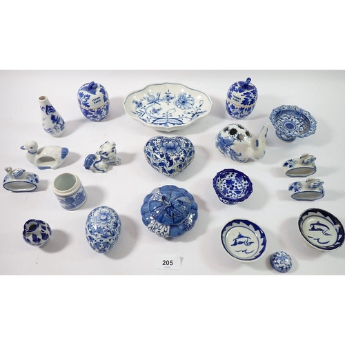 205 - A collection of various blue and white china items including lidded bowls, small pedestal bowls, nap... 