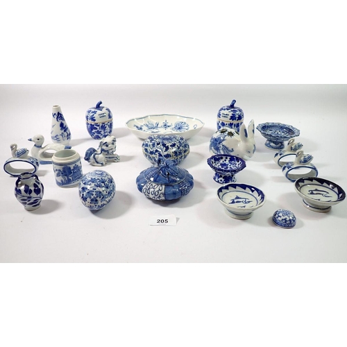 205 - A collection of various blue and white china items including lidded bowls, small pedestal bowls, nap... 