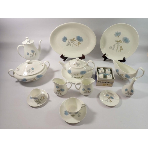 209 - A Wedgwood Ice Rose dinner service comprising three serving platters, seven dinner plates, eight sid... 