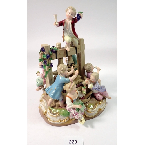 220 - A 19th century Meissen group of children playing around a wine press, crossed swords mark to base, 2... 