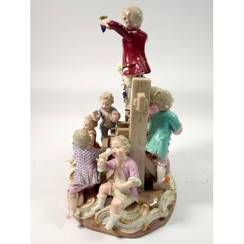 220 - A 19th century Meissen group of children playing around a wine press, crossed swords mark to base, 2... 