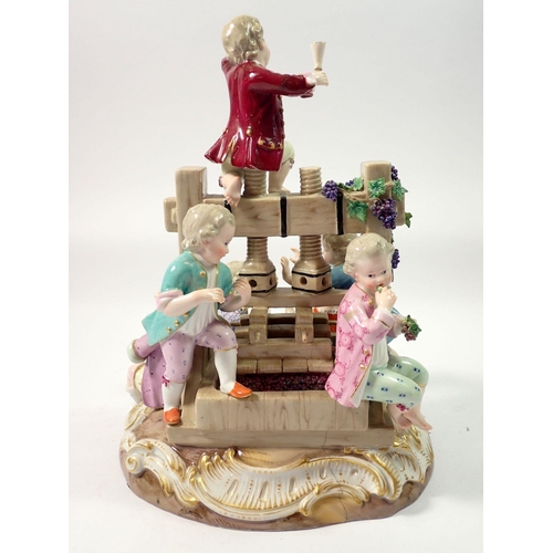 220 - A 19th century Meissen group of children playing around a wine press, crossed swords mark to base, 2... 