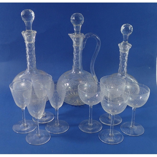 239 - Three Victorian facet cut glass decanters, four cocktail glasses and four sherry glasses, all etched... 