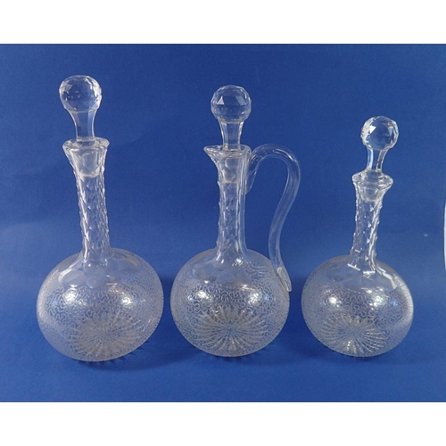 239 - Three Victorian facet cut glass decanters, four cocktail glasses and four sherry glasses, all etched... 