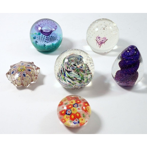 251 - Six various glass paperweights including three by Caithness