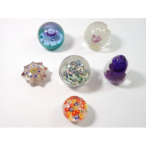 251 - Six various glass paperweights including three by Caithness