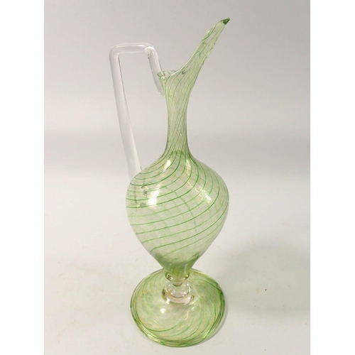 264 - A 19th century Salviati green glass ewer, 24cm tall