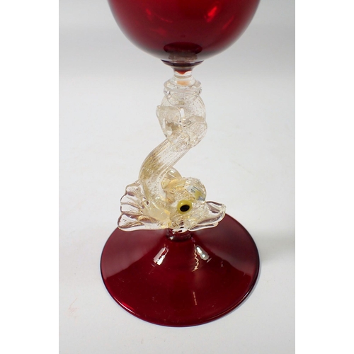 265 - A 20th century Salviati red goblet on dolphin stem, 21cm tall