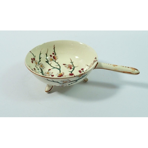 27 - A 19th century Faience small dish with handle painted blossom by keller & guerin, 10cm diameter