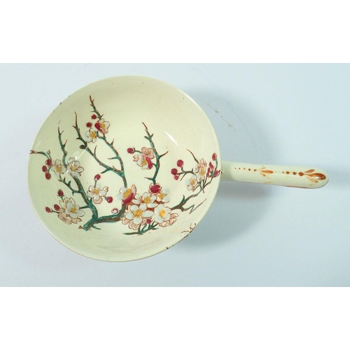 27 - A 19th century Faience small dish with handle painted blossom by keller & guerin, 10cm diameter