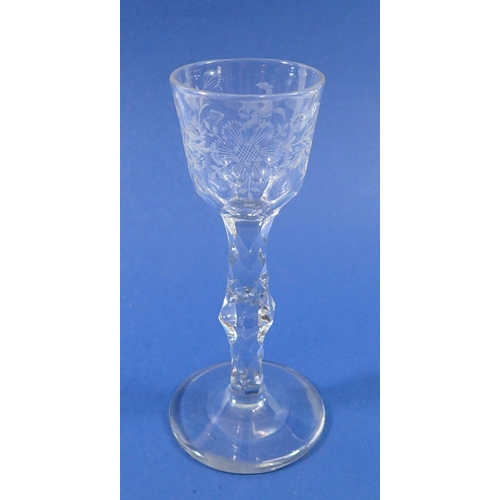 270 - An antique wine glass with facet cut stem and bowl engraved bird and flowers, 15.5cm