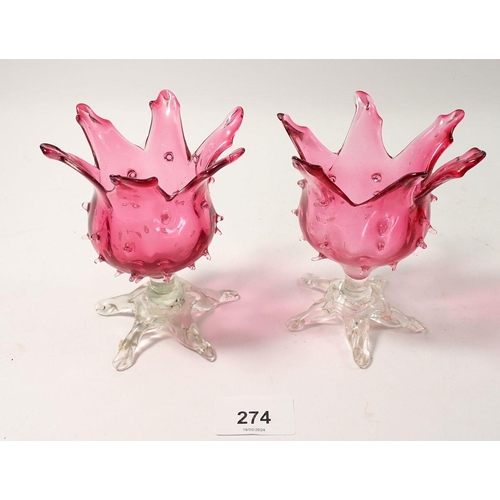 274 - A pair of Victorian cranberry glass flower form vases, 12cm tall