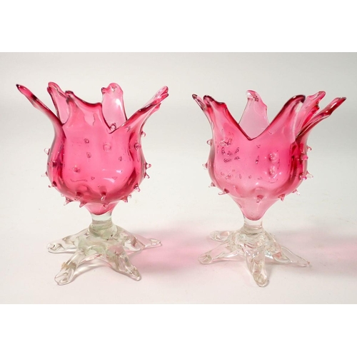 274 - A pair of Victorian cranberry glass flower form vases, 12cm tall