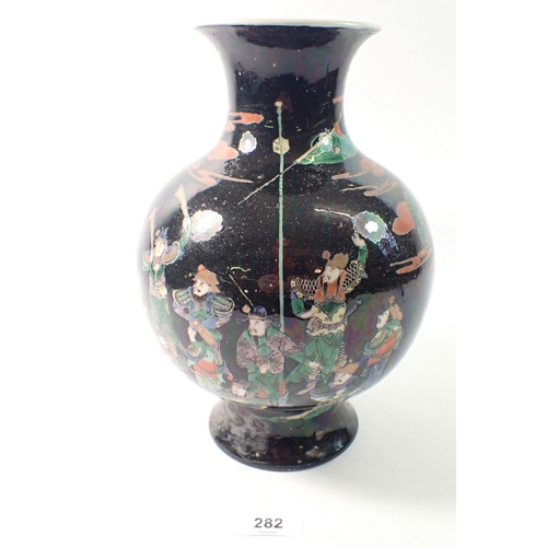 282 - A Chinese famille noir bulbous vase painted warriors attending a Royal Palace, 26cm