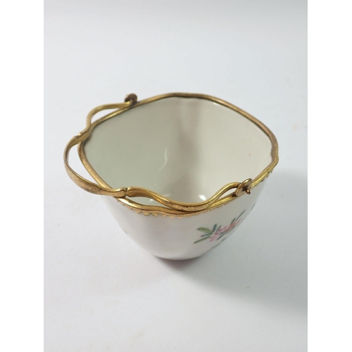 288 - A late 18th century Japanese Kakiemon bowl with European gilded metal mounts and handle, 8.5cm wide