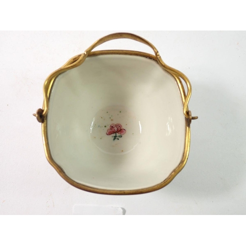 288 - A late 18th century Japanese Kakiemon bowl with European gilded metal mounts and handle, 8.5cm wide