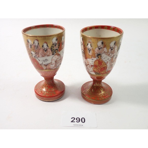 290 - A pair of mid 19th century Meiji period Japanese Kutani '1000 Faces' sake cups, signed to base