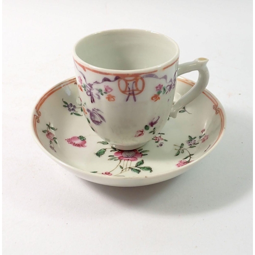 292 - A Chinese famille rose cup and saucer painted ribbons and flowers