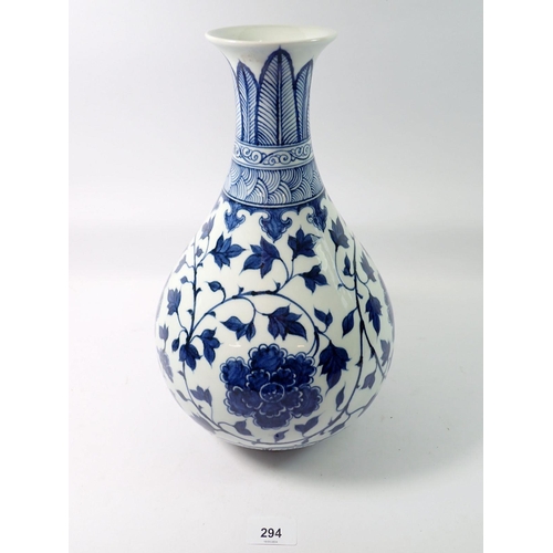 294 - A Chinese blue and white baluster vase decorated peony and trailing leaves, 34cm tall