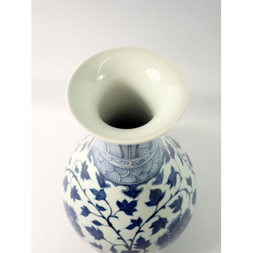 294 - A Chinese blue and white baluster vase decorated peony and trailing leaves, 34cm tall