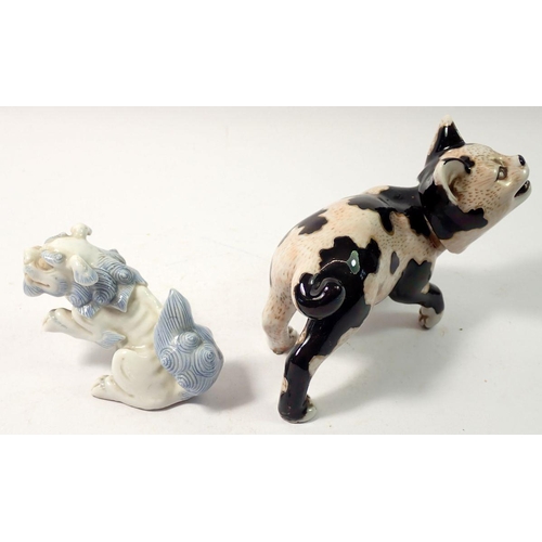 295 - A Japanese porcelain model cat, 13cm and a Kylin dragon