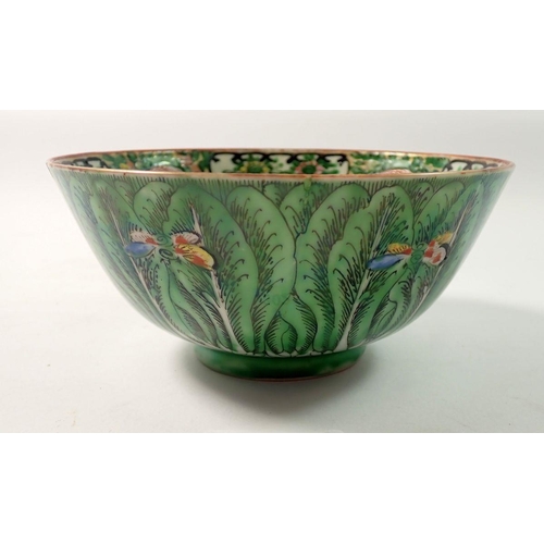 302 - A Chinese Canton bowl painted leaves and butterflies - 15cm diameter