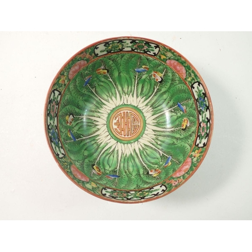 302 - A Chinese Canton bowl painted leaves and butterflies - 15cm diameter