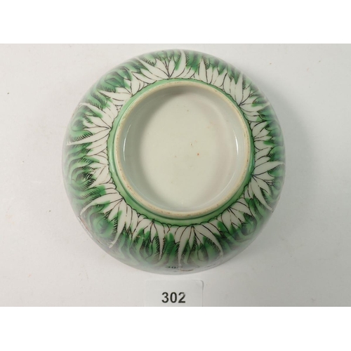 302 - A Chinese Canton bowl painted leaves and butterflies - 15cm diameter