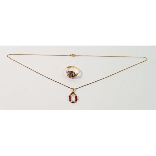 679 - A 333 standard gold pendant set red stones and a yellow metal ring set white stones, total 3.4g