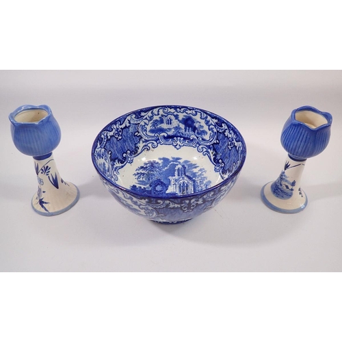 68 - An Abbey blue and white fruit bowl and two Delft tulip form candlesticks, 16cm tall